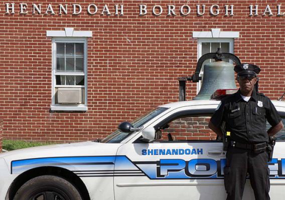Shenandoah Patrolman Kirk Kirkland stands in front of his police cruiser in front of Borough Hall. An $18,240 Rural Development Community Facilities Economic Impact Initiative grant will help the Borough purchase a new four-wheel drive police cruiser to better serve the rural residents of Shenandoah.