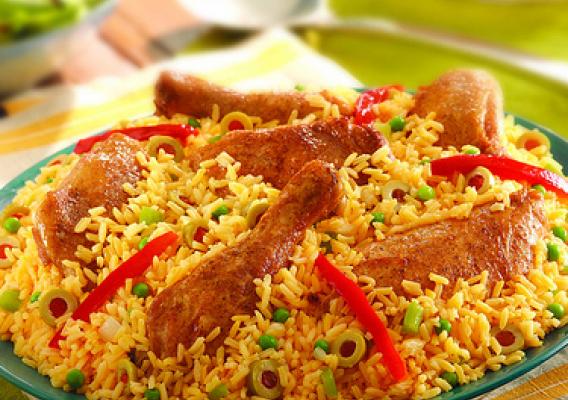 Image of rice with chicken on plate.