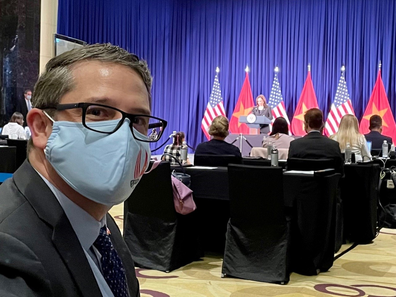 APHIS Foreign Service Officer Joe Vukovich observes VP Kamala Harris as she delivers a speech in Hanoi, Vietnam