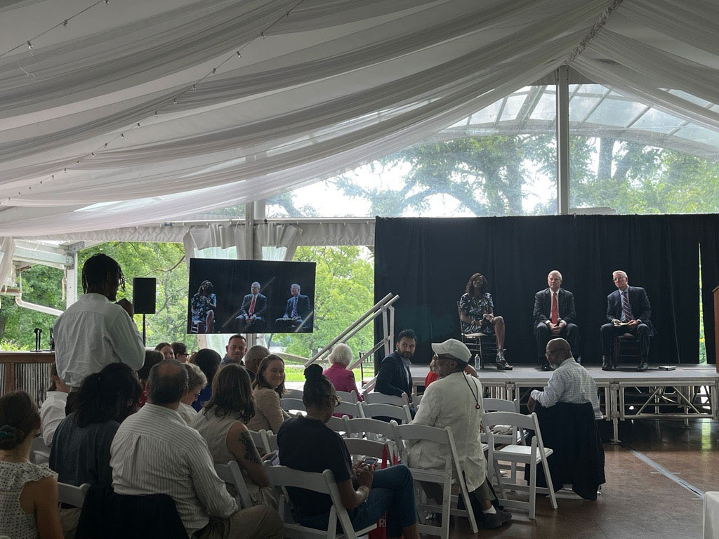 An audience participant asking a question. Pictured from left to right on stage: USDA Chief Scientist and Under Secretary for Research, Education, and Economics Dr. Chavonda Jacobs-Young, Agriculture Secretary Tom Vilsack, and Pennsylvania Department of Agriculture Secretary Russell Redding