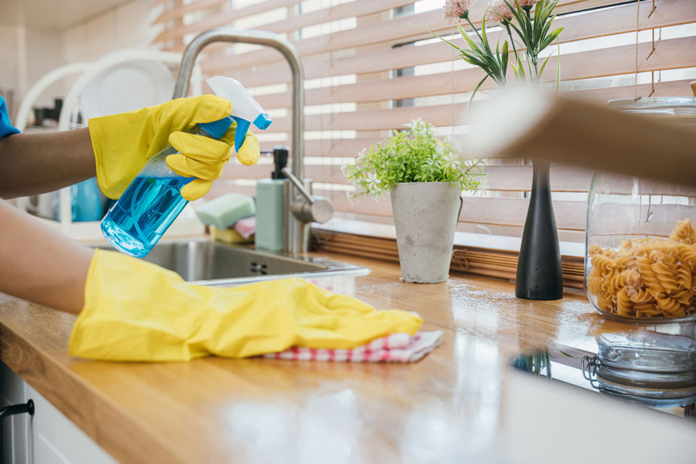 A person cleaning a kitchen