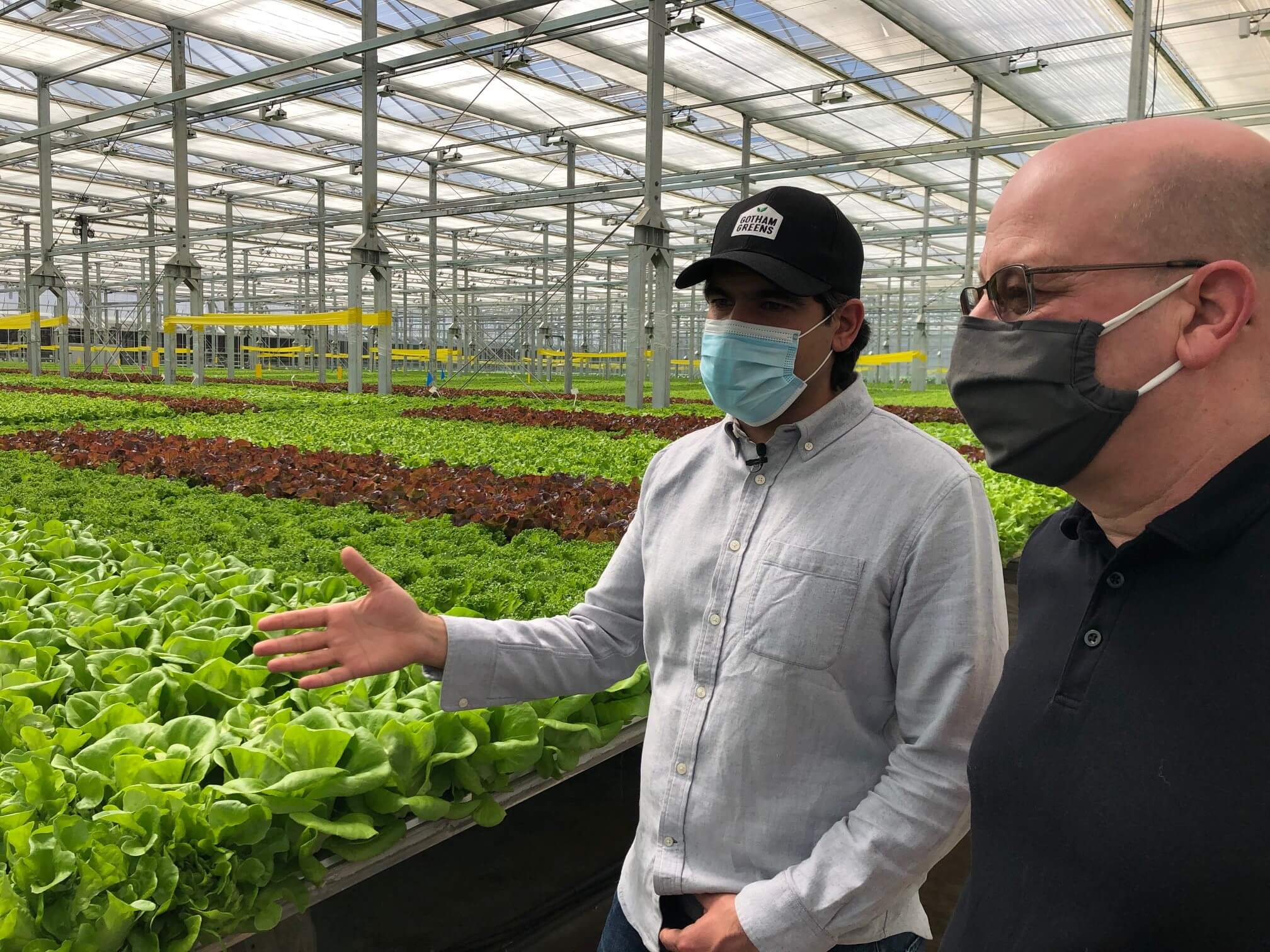 Viraj Puri (left), Chief Executive Officer of Gotham Greens, shows Scott Kessel, Acting Delaware and Maryland State Director for the USDA Rural Development, the renewable energy technology