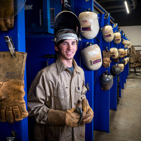 Young man in welding apparel