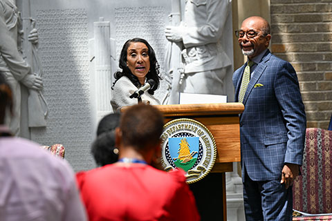 Dr. Penny Brown Reynolds, Acting Assistant Secretary for Civil Rights, presents Ali Muhammad, AMS Civil Rights Deputy Director, with an award during the Juneteenth Observance and the Flag Raising Ceremony