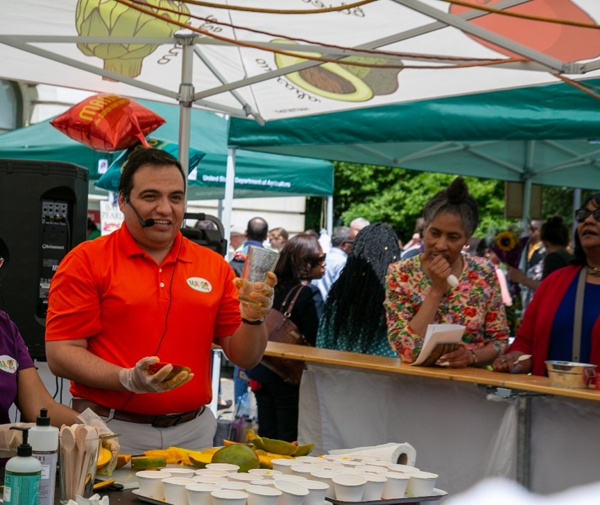 A man speaking at the Farmer's Market