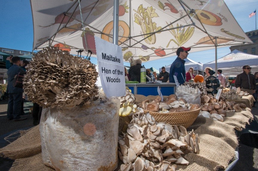 A vendor selling mushrooms