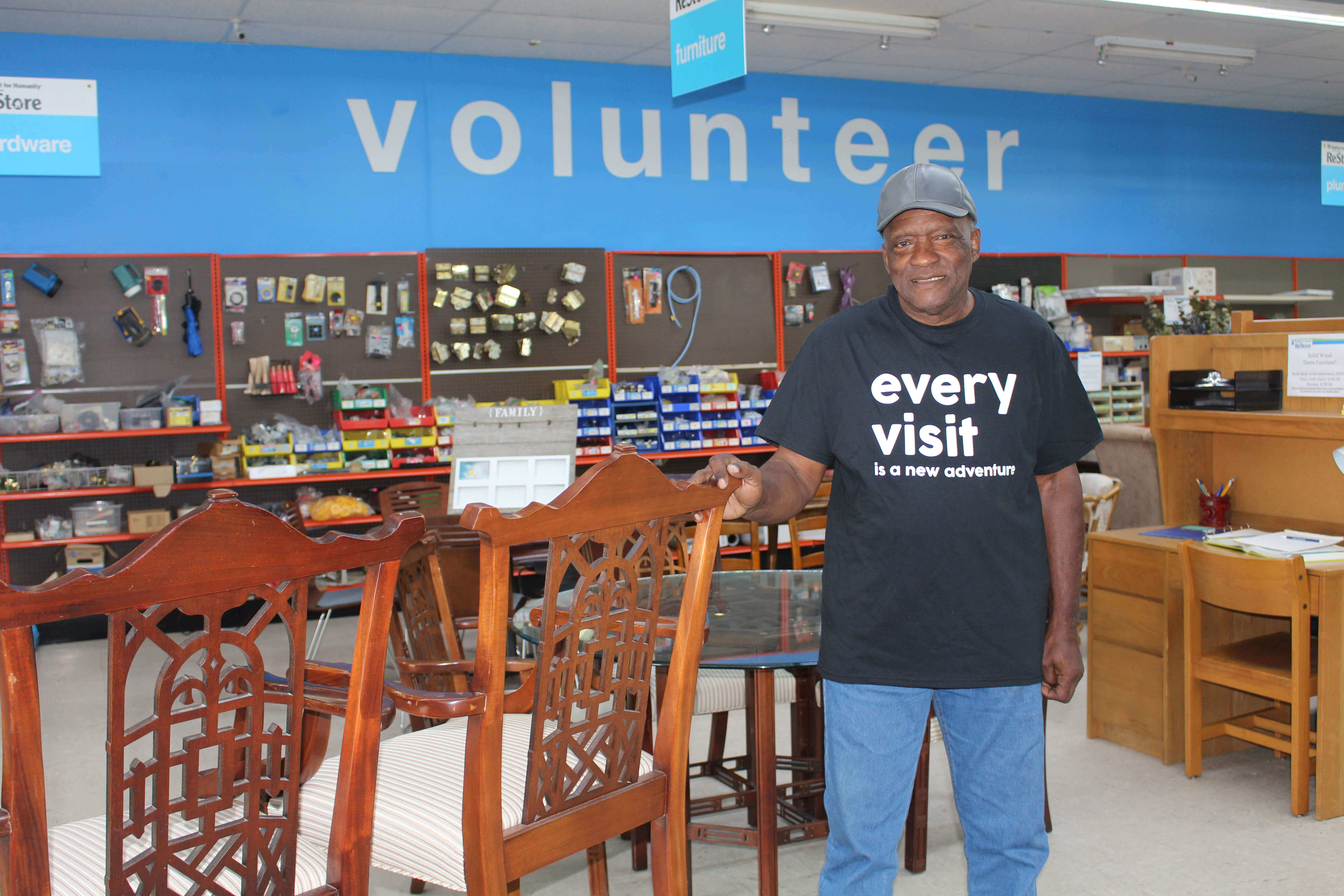 Richard Norman inside a hardware store volunteering