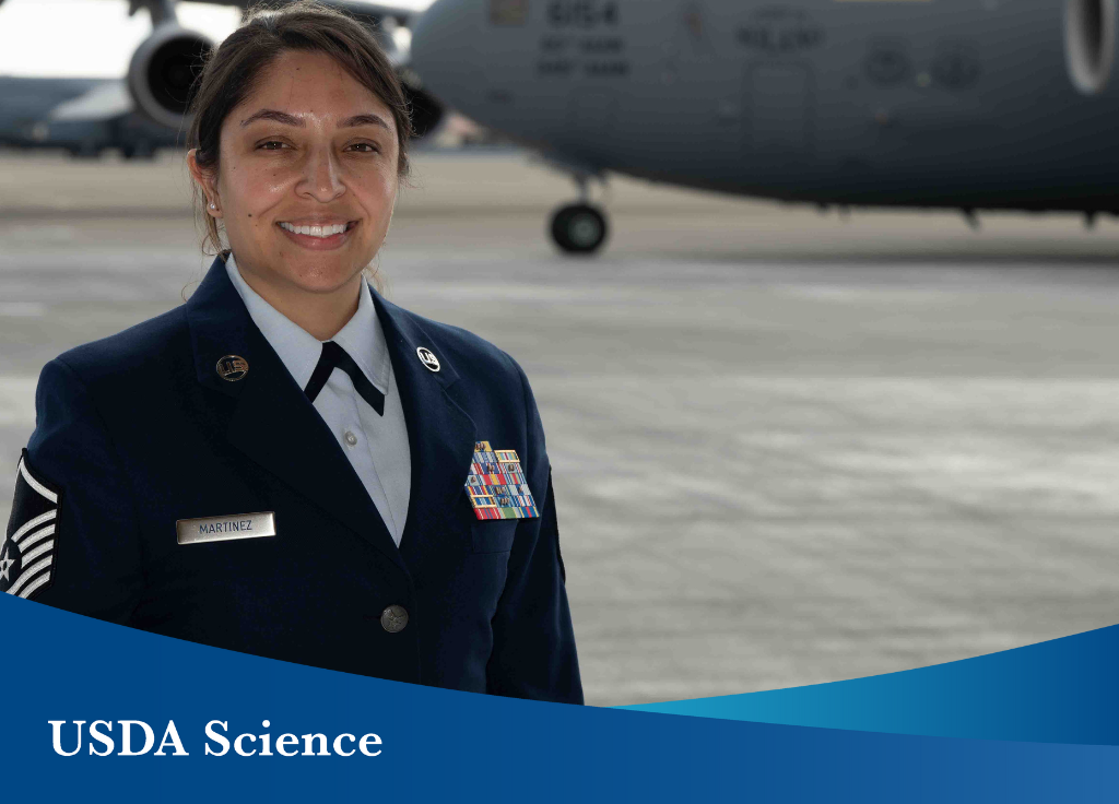 A photo of Master Sergeant BreAnna Martinez wearing her U.S. Air Force's Service Dress Uniform. There is an airplane in the background of the photo