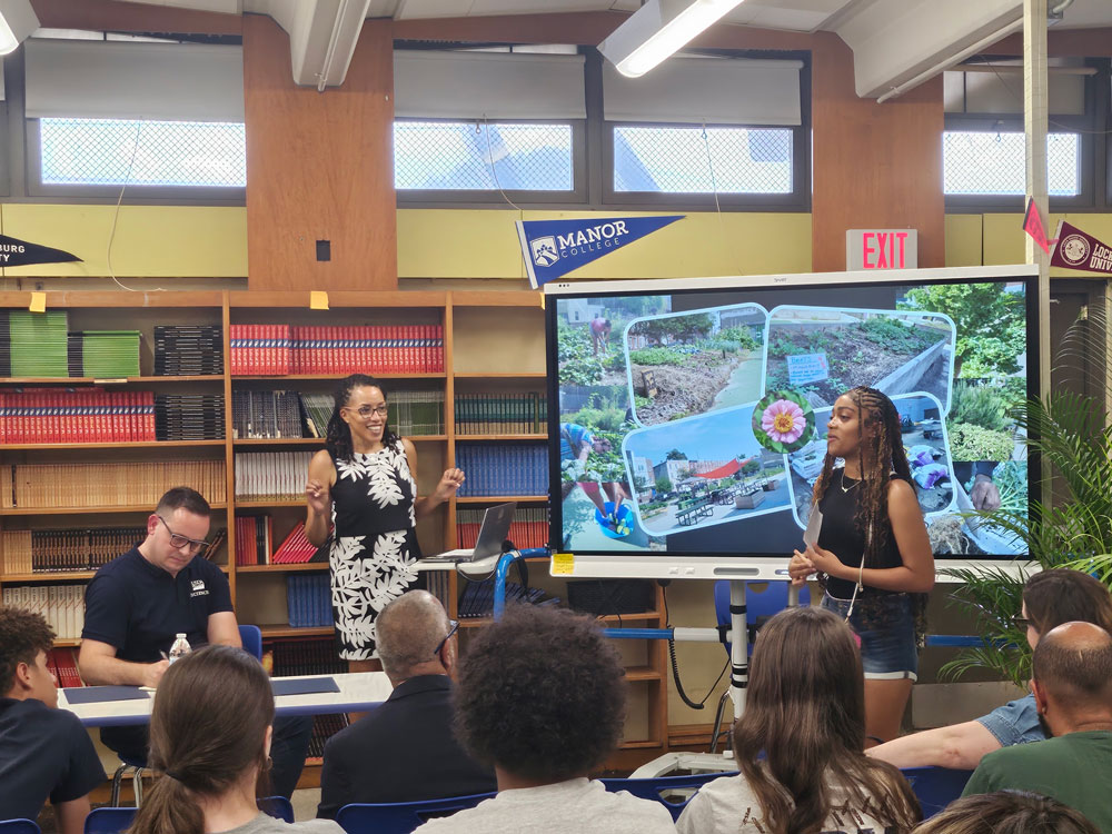 A Philadelphia student presenting on their agriculture projects to USDA staff and others