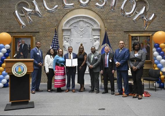 USDA staff and employees stand for a group photo with members of the Lumbee Tribe as well as guests from the University of North Carolina at Pembroke during the Unity Through Inclusion celebration on Tuesday, October 1, 2024, at the USDA Headquarters, Washington D.C.