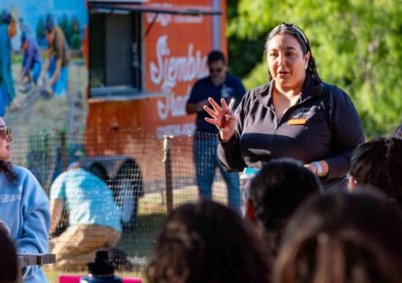 A woman speaking to a group