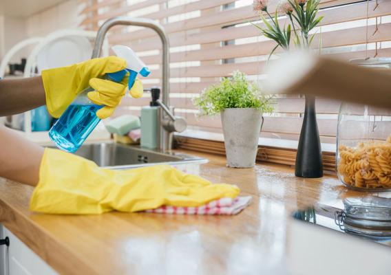 A person cleaning a kitchen