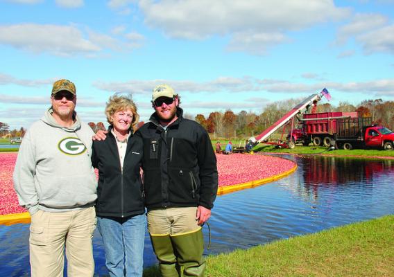 Roy Diver, NRCS District Conservationist; Mary Brazeau Brown, Glacial Lake Cranberries (GLC) President; and Stephen Brown, GLC Vice President