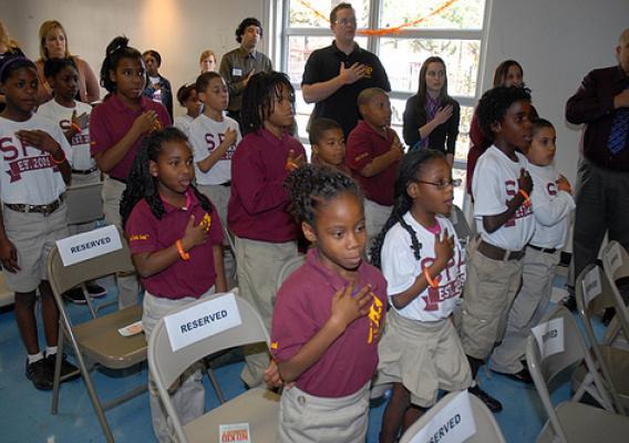 Students from Success Preparatory Academy lead the pledge of allegiance at the kick-off of the No Kid Hungry campaign in New Orleans on November 12.  