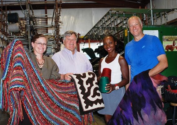 Business Program Specialist Deborah Rausch, Ohio Rural Development State Director Tony Logan, Toia Rivera-Strohm and Brad Strohm show off local textiles from the VonStrohm Woolen Mill & Fiber Arts Studio in Pickaway County. The small business was awarded VAPGs in 2010 and 2012. (USDA photo)