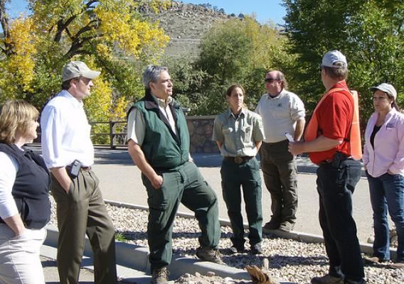 Undersecretary Robert Bonnie (second from left) is briefed by NRCS Soil Conservationist Don Graffis.  Graffis discussed  NRCS recovery efforts in the wake of a 2013 flood near Lyons Colorado. NRCS photo.