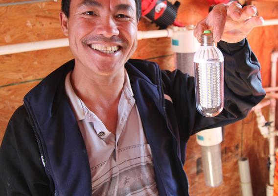 Stanley Lee has put more efficient light bulbs in his chicken houses and made other updates that lower his carbon footprint.
