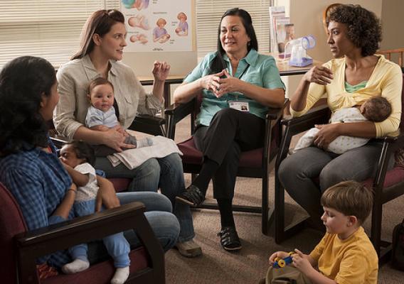 New moms participate in a group discussion with WIC counselor.