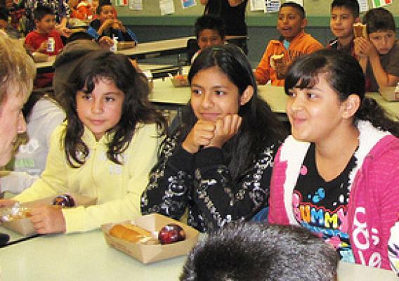 USDA Deputy Under Secretary Janey Thornton talks with children participating in the Summer Food Service Program at Calabasas Elementary School in Watsonville, California.