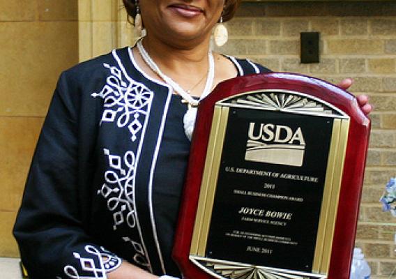 Director of Contracting Activity Designee Joyce Bowie with her award.  