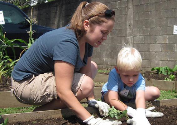 Sara Roy and her son, Malachi, enjoy working together in the garden.