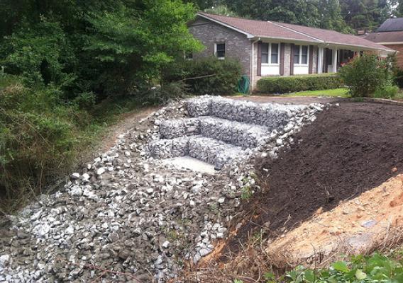 Through the Emergency Watershed Protection Program, NRCS helped tame a major erosion problem and save a West Columbia, S.C. home. NRCS photo.