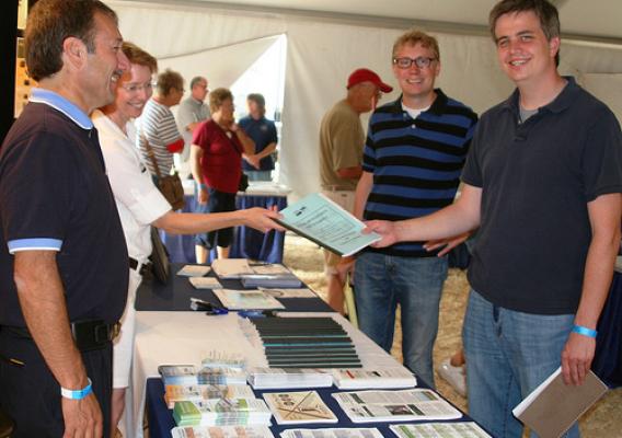 USDA Officials handing out program information during the 2012 South Dakota State Fair.