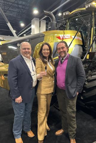 Secretary Rollins at Commodity Classic with two people