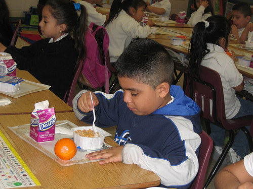 child eating breakfast at school